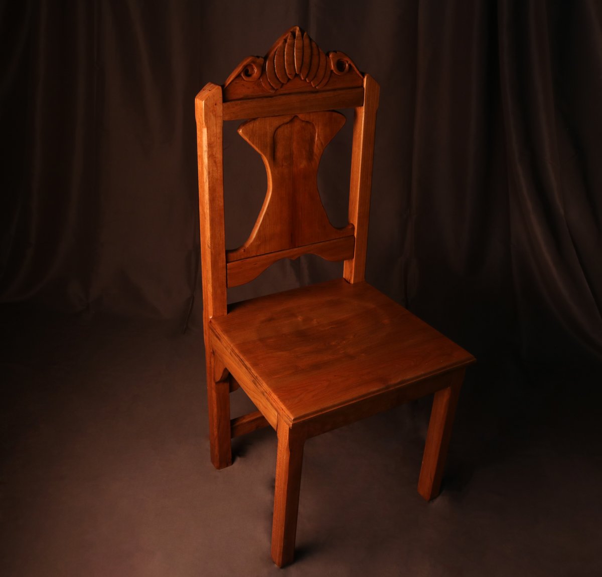 Sedes Umbrae - Chair in darkened cherry with carved palmette crest